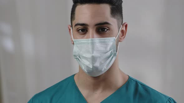 Close Up Male Face Hispanic Arab Man Doctor Nurse in Safety Medical Mask Confident Looking at Camera alt