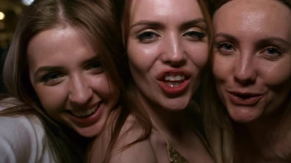 Three Chicks Blow Kisses at Camera alt