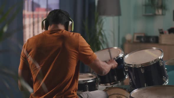 Indian Man Playing Drums in Evening alt