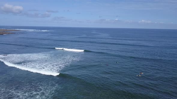 A View From Above of the Surfers in the Ocean