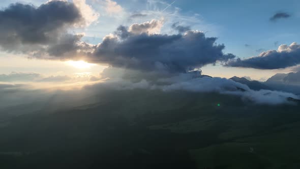Dolomites mountains peaks with a hiking path on a summer sunrise alt
