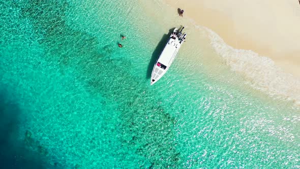 Viti Levu Island, Fiji - Tourists Enjoy the Bright Summer Day On The Beach Surrounded By Green Shall alt