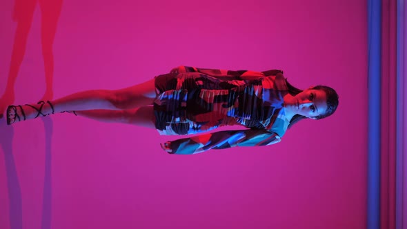 Fashionable Sexy Woman Model of Asian Appearance in a Business Pink Suit alt