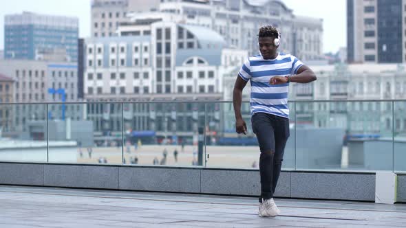 Cool Guy in Headset Performing Afrohouse Dance alt