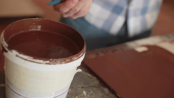 Carpenter Paints Products with Protective Paint