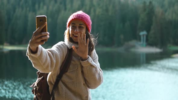 20s Hiker Photographer Hipster Woman in Woods Shooting Selfie Lake View alt