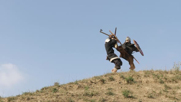 Viking pushing enemy down the hill alt