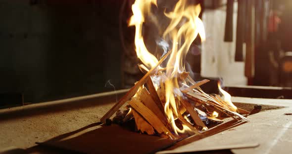 Burning fire at fireplace for blacksmith work alt