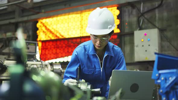 asian female Professional engineering wearing uniform and safety goggles alt