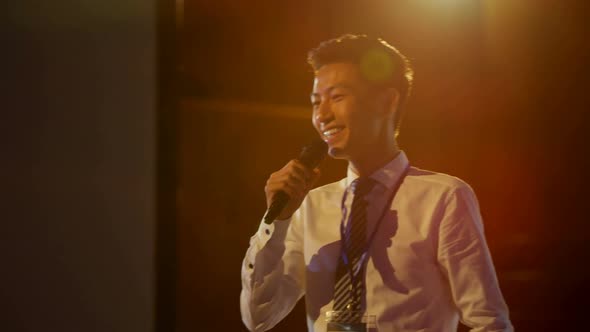 Young Asian businessman speaking in business seminar at auditorium 4k alt