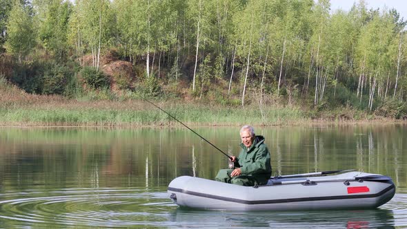 Retired Fisherman Fishing On The Lake