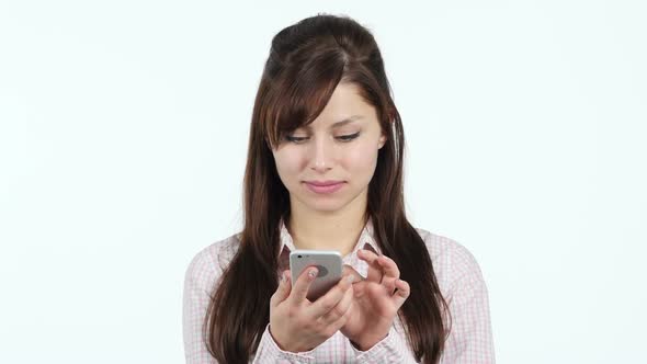 Young Girl Busy Using Smartphone alt