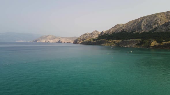 Aerial of deep blue see surrounding Krk island coastline in Baska, Croatia. Oprna Bay, Krk Island, K alt