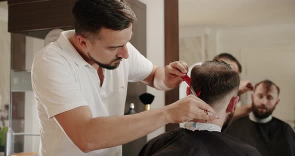 Hairdresser Male Cutting Hair with Scissors Closeup alt