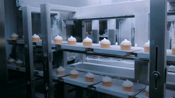 Automated Technology Concept - Conveyor Belt with Icecream Cones at Food Factory