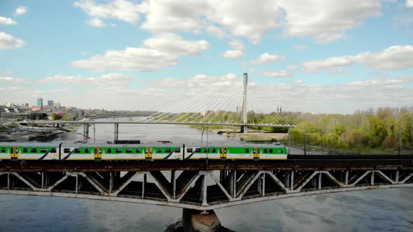 Urban Train Rides on a Bridge Over a River