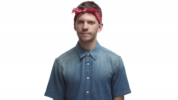 Young Confident Man with Beard Wearing Red Headband Agree with you Saying Yes and Looking Serious