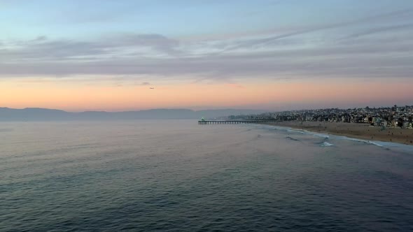 Scenic Sunset At Manhattan Beach In California, USA - aerial drone shot alt