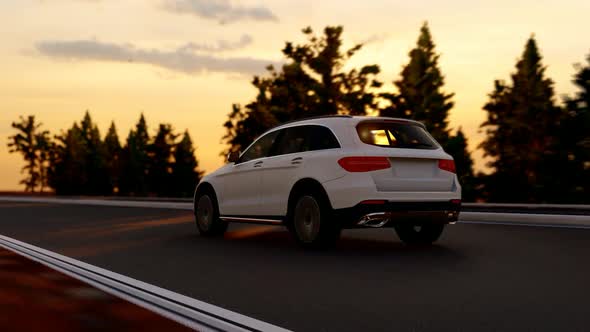 White Luxury SUV Rear Camera Shot with Sunset View