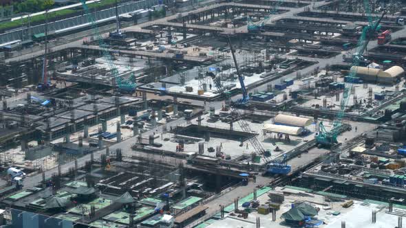 Large Construction Site with Heavy Construction Machinery in Metropolis alt