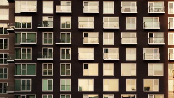 Day to night timelapse of modern apartment block