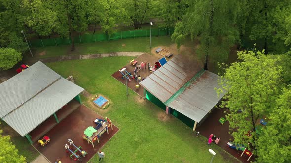 Children Play on the Playground in Kindergarten in Summer Aerial View