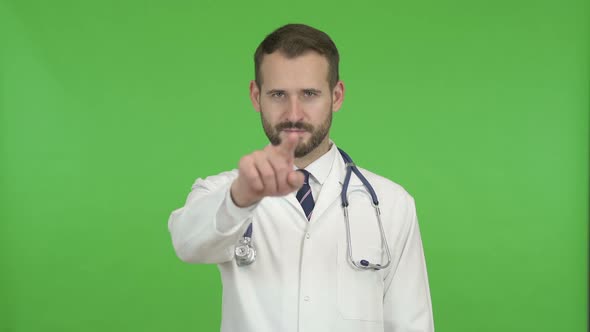 Young Male Doctor Gesturing to Call Him for Help Against Chroma Key alt