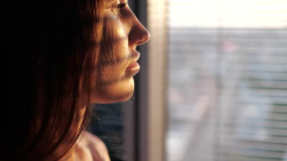 Close Up of a Girl Looking Out the Window