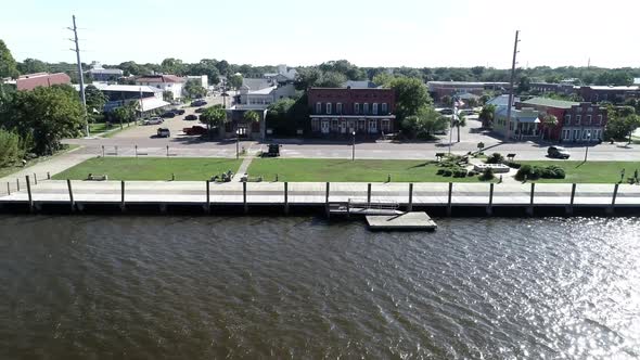 Apalachicola City Dock and Water Street in Apalachicola, Florida are seen from the Apalachacola Rive alt
