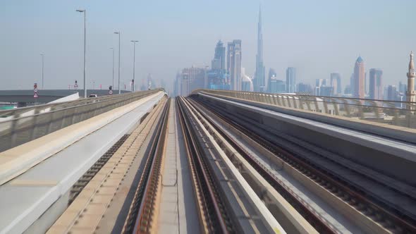 First View Perspective Backwards From Driverless Subway Car As Metro Coach Going Across Dubai City