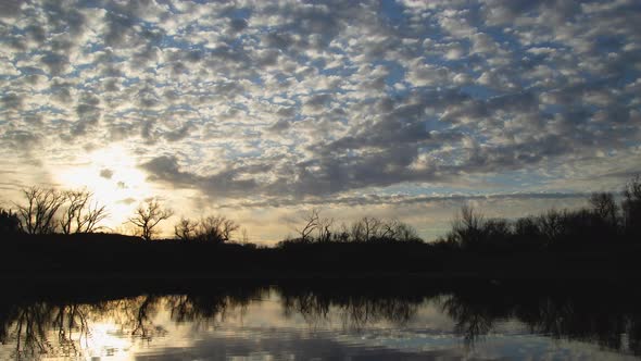 Brilliant Sunrise Clouds Over Lake Medium Shot Timelapse