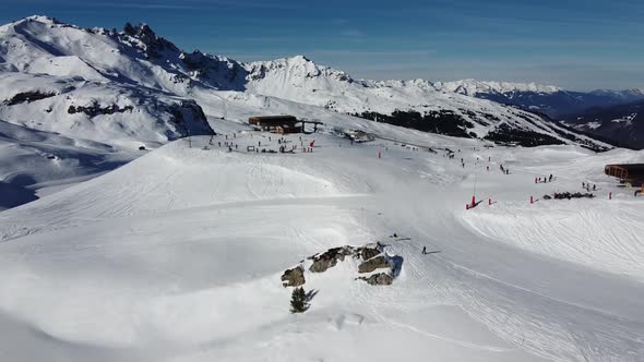 Aerial View of the Alps Mountains in France. Mountain Tops Covered in Snow. Alpine Ski Facilities