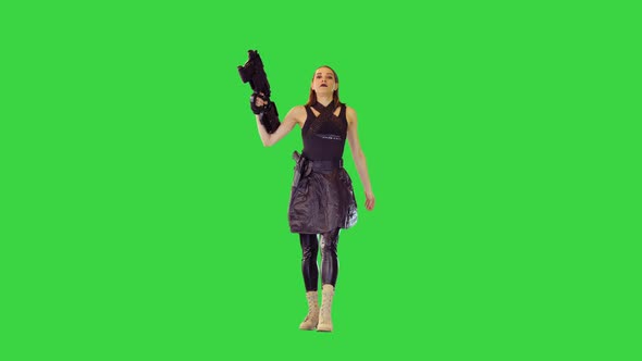 Animecharacter Girl in Military Clothes Walks with Machine Gun on a Green Screen Chroma Key