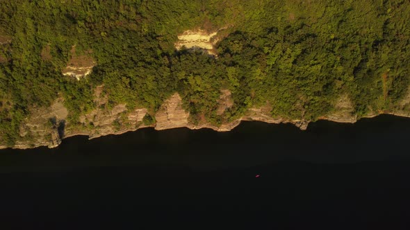 Aerial view of wide Dnister river and distant rocky hills in Bakota area, part of the National park