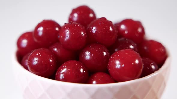 Large Ripe Cherries in a White Plate