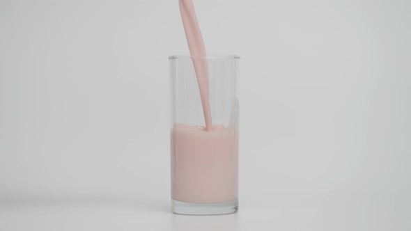 Super Slow Motion of Pouring Chocolate Milk in Transparent Glass at 1000 Fps alt