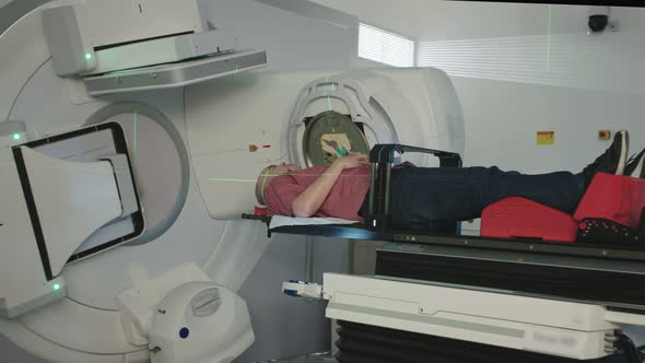 Patient Getting Radiation Therapy Treatment Inside A Modern Radiotherapy Room alt