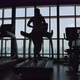 Young Fit Woman Running on Treadmill in Gym Back View. Cardio Training Weight Loss Motivation - VideoHive Item for Sale