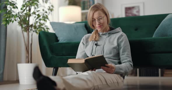 Woman Reading Book at Home