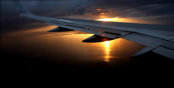 Airplane Flying Over Clouds alt