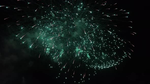 Colorful firework flashes at night
