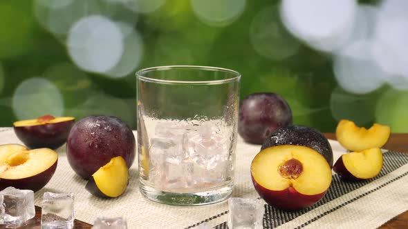 Plums Juice Pour Into Glass