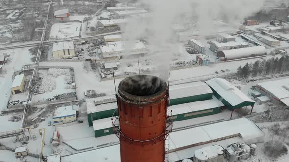Aerial View on Power Plant Pipe with White Smoke in Winter