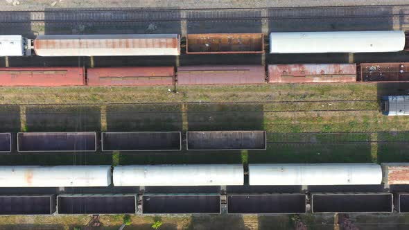 Flying Above Cargo Carriages at Railroad Station alt