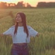 Oriental Young Woman is Walking Alone on Beautiful Rye Field in Sunrise Portrait  Prores - VideoHive Item for Sale