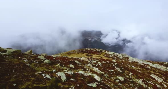Mountain Foggy Valley. Misty Alps Landscape. Snowy Peaks in Brumous Cloudy Chamonix Mont Blanc