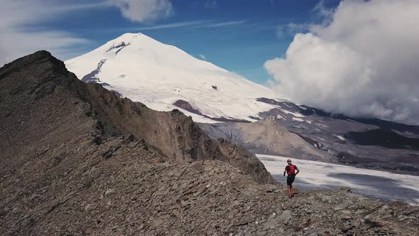 Running Man on a Rocky Trail in a Big Mountains Healthy Fitness Lifestyle Training