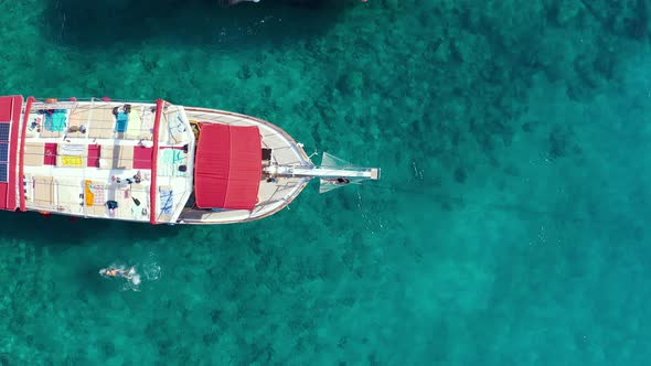 Girl in Bikkini Lies Hammock on the Bow of a Yacht Against the Backdrop of the Sea alt