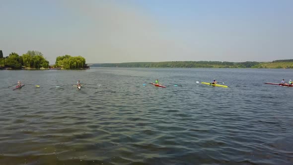 Training Athlete In Kayak. Training of small sportsmen rowers on a kayak on the river alt