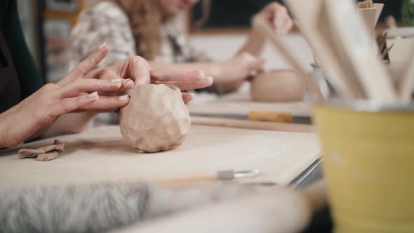 Closeup on Artist Hands Personalizing a Clay Cup Traditional Latin American Dishes Craftsman alt